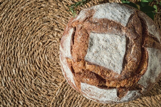 Round freshly baked rustic rye round bread Top view with copy space