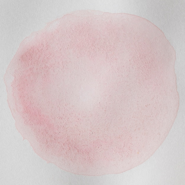 丸い淡い形の抽象的な水彩インクの背景
