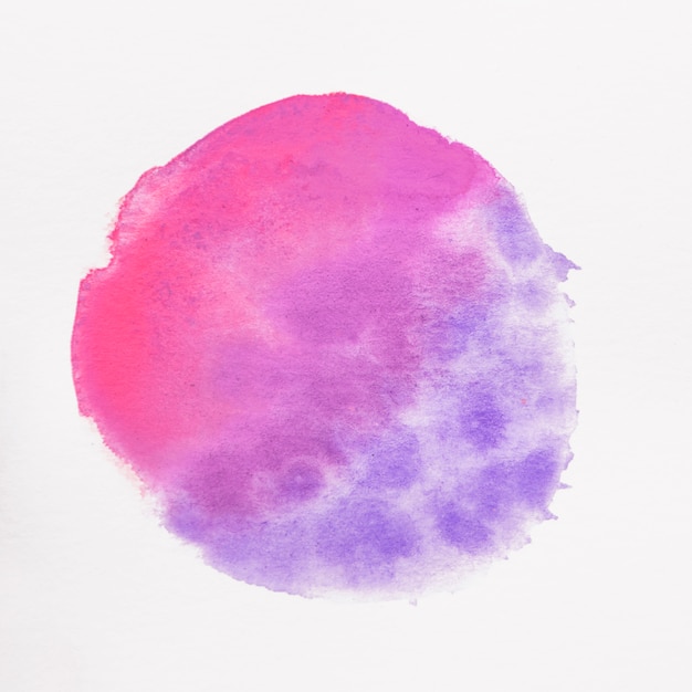 Round pink and blue stain on white background