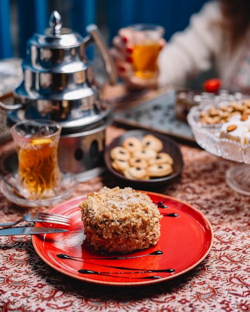 Round portioned cake covered with cake crumbles