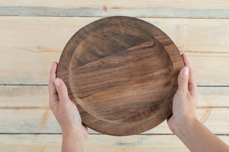 Free Photo round snack platter with carved pieces in it. 