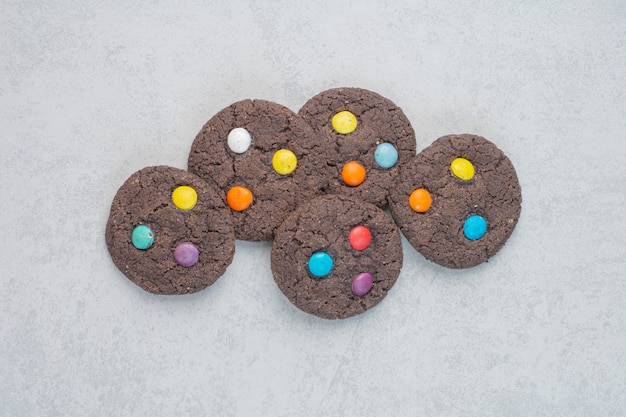 Free photo round sweet chocolate cookies on white table .