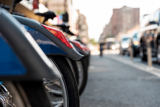 Row of bicycles with blurred city background