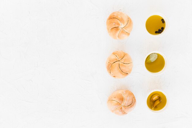 Row of buns arranged with different oils in the bowl