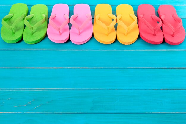 Row of colorful flip flops 