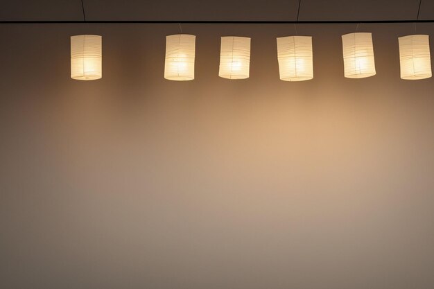 A row of paper lanterns hanging from a ceiling