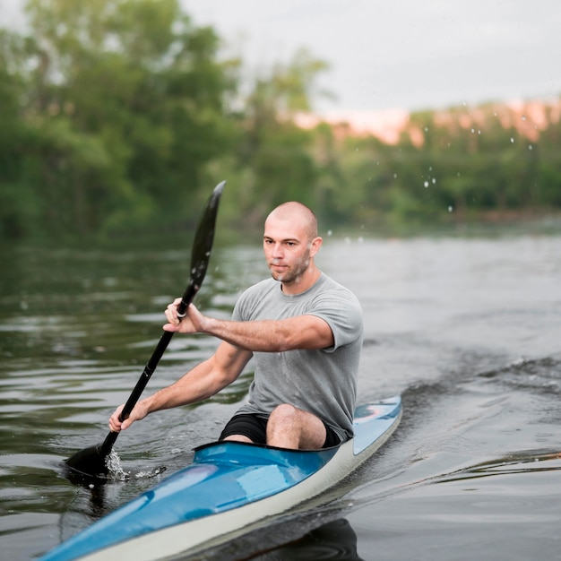 Rowing concept with man paddling