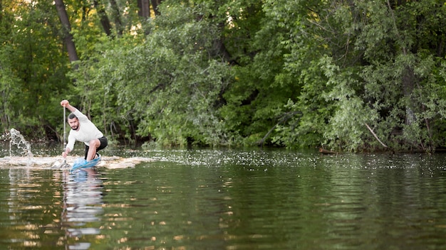 Rowing concept with young man