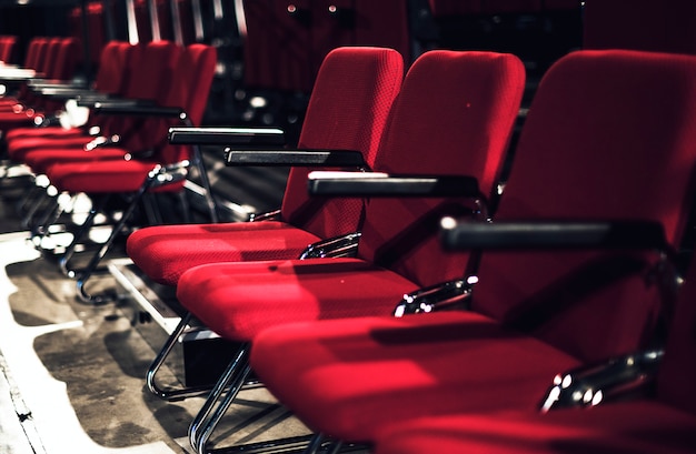 Rows of red seats in a theater