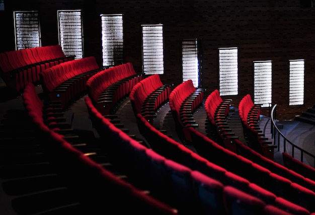 Rows of red seats in a theater