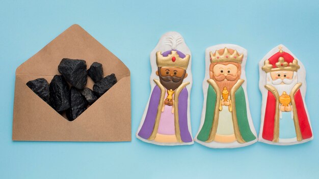 Royalty biscuit edible figurines and coal ore in envelope
