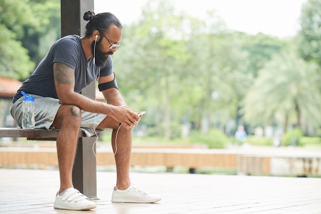 Runner Using Smartphone Outdoors