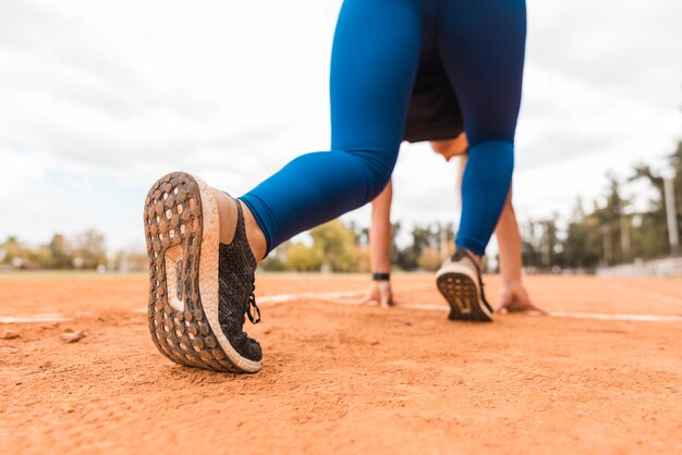 Runner woman in starting position