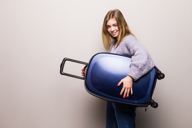 Running woman with suitcase. beautiful girl in motion. Traveler with baggage isolated. traveling teen girl