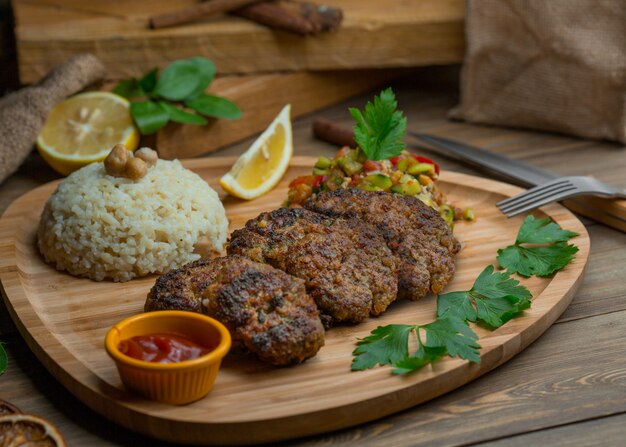 Russian cotlets with garnish and sauces.