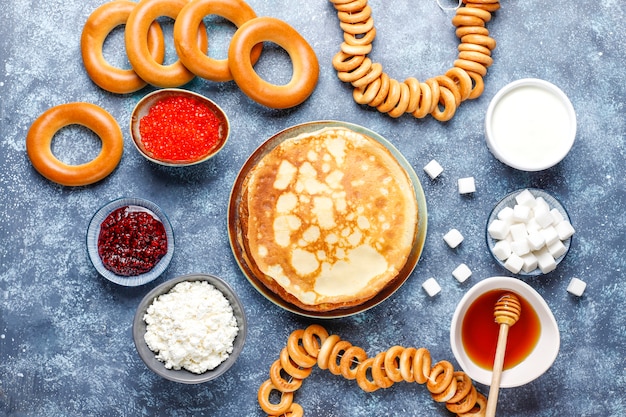 Free photo russian pancake blini with sauces and ingredients