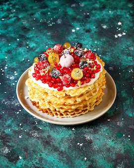 Russian waffle cake with sour cream and berries