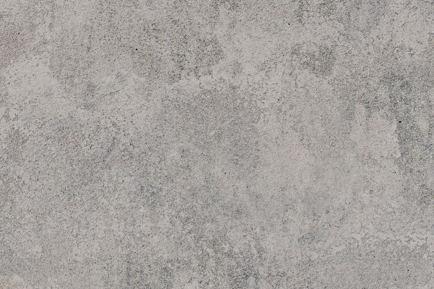 素朴な灰色のコンクリートの織り目加工の背景
