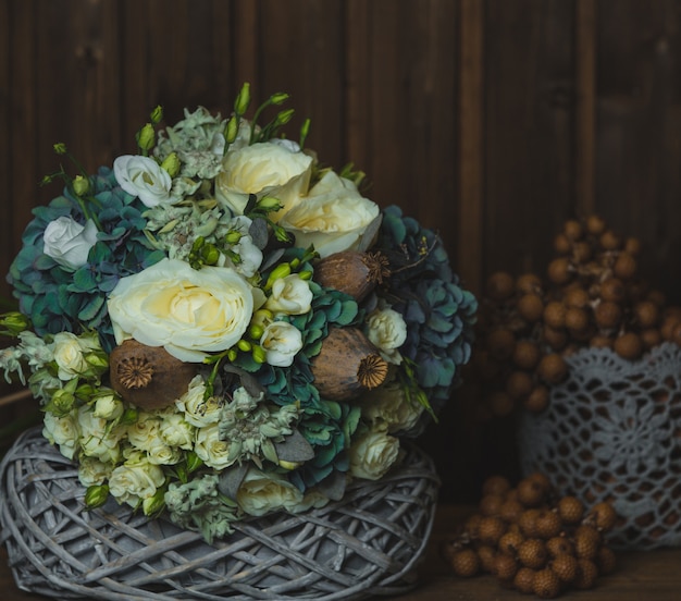 Free photo rustic style flower bouquet and blossoma in baskets