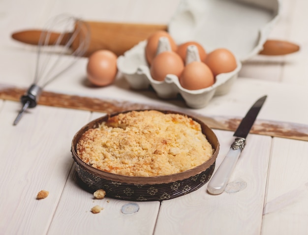 Rustic style of pie apple on white desk