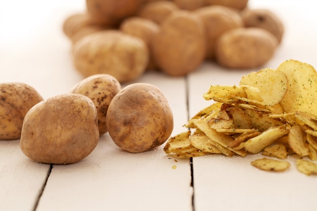 Rustic unpeeled potatoes and chips