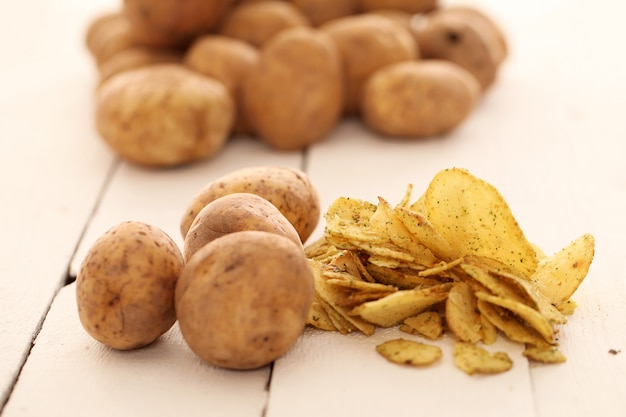 Rustic unpeeled potatoes and chips