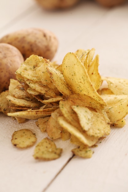 Rustic unpeeled potatoes and chips