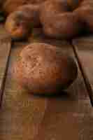 Free photo rustic unpeeled potatoes on a desks