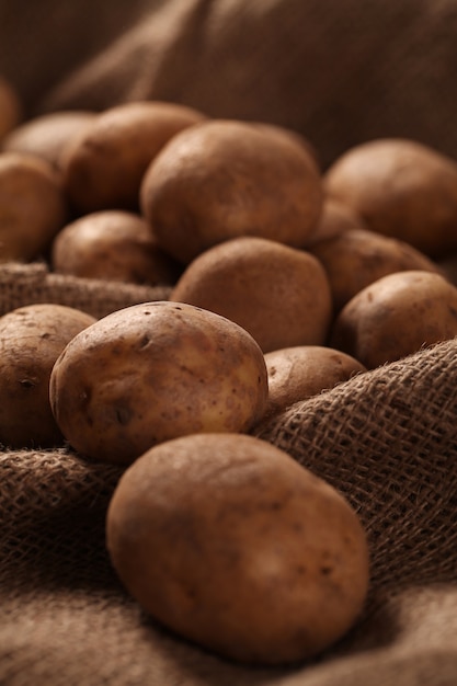 Rustic unpeeled potatoes on a desks