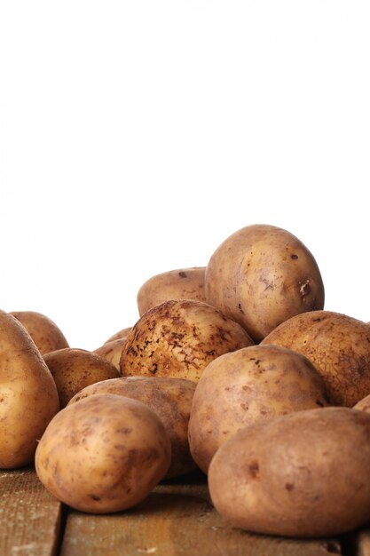 Rustic unpeeled potatoes on a table