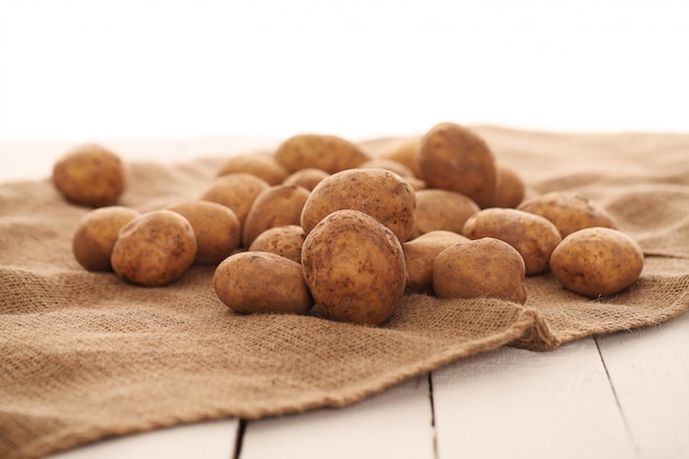 Rustic unpeeled potatoes on a table