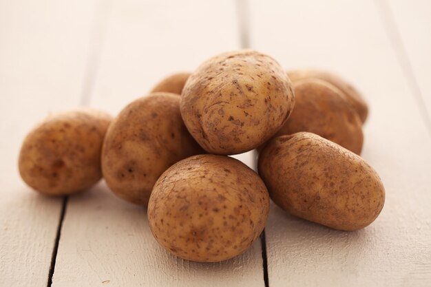 Rustic unpeeled potatoes on a table