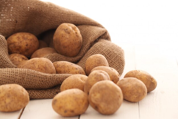 Rustic unpeeled potatoes on a table