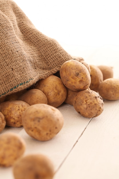 Rustic unpeeled potatoes on a table