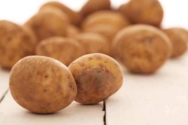 Rustic unpeeled potatoes on a table