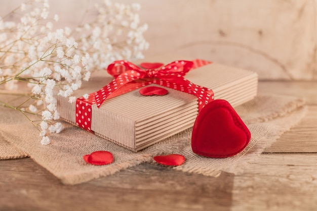 Free photo rustic valentine's day with cute gift