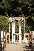 Free photo rustic wedding aisle in a garden.