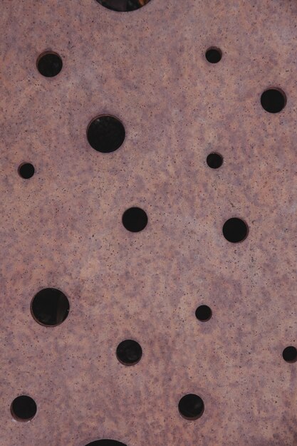 Rusty metal sheet with holes