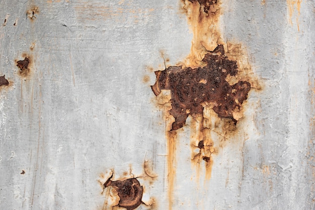 Free photo rusty metallic surface with peeling paint