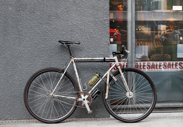 Rusty old bicycle near wall