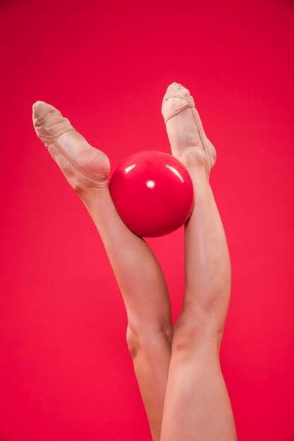 Rythmic gymnast feet with ball