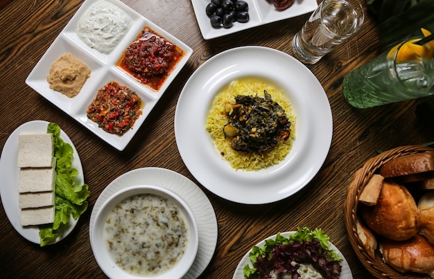 Free photo sabzi pilaf and other food on the table top view