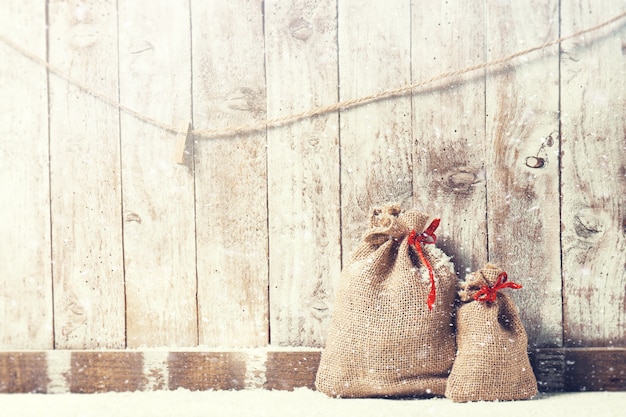 Sacks of fabric with a red bow