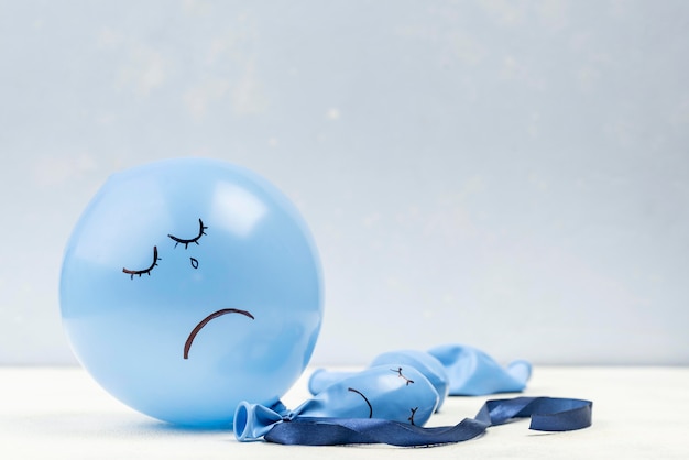 Free photo sad balloon with copy space for blue monday