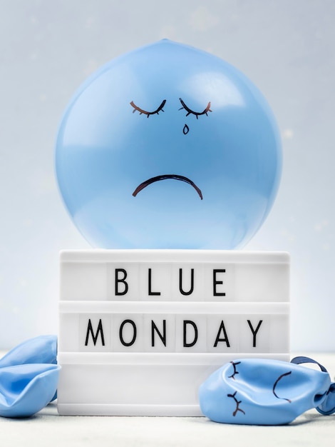 Sad balloon with light box for blue monday