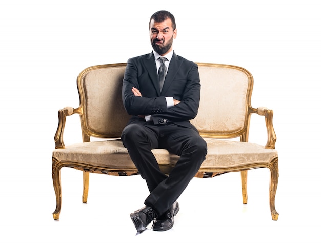 Sad Businessman sitting on armchair