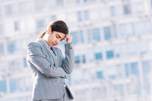 Sad businesswoman outdoors