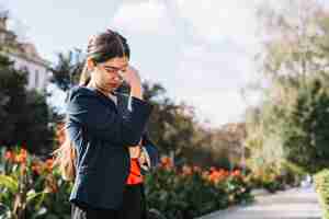 Free photo sad businesswoman outdoors