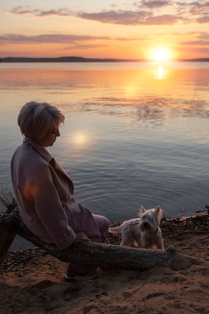 Sad and contemplative person near lake