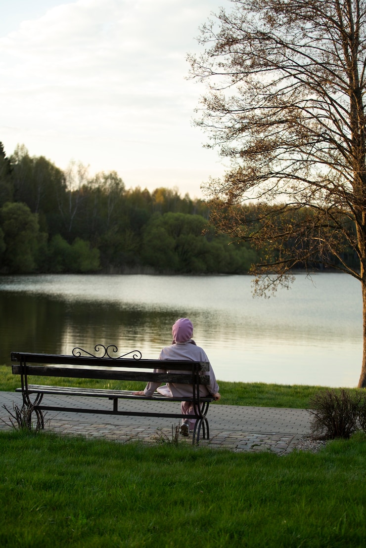 Free Photo sad and contemplative person near lake